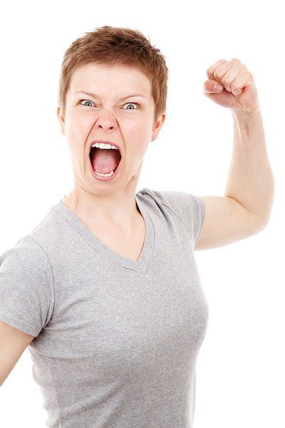 Angry woman making fist - You are the moment