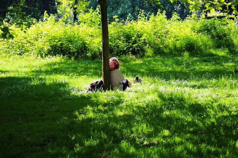 woman sitting alone in the park