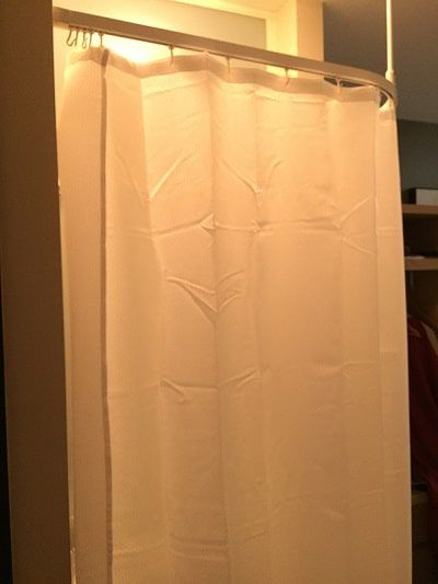 Shower curtain with washbasin behind it - Going down under and coming back up