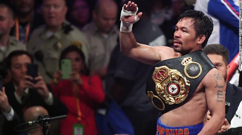 Manny Pacquiao sports another belt in his legendary boxing career. 