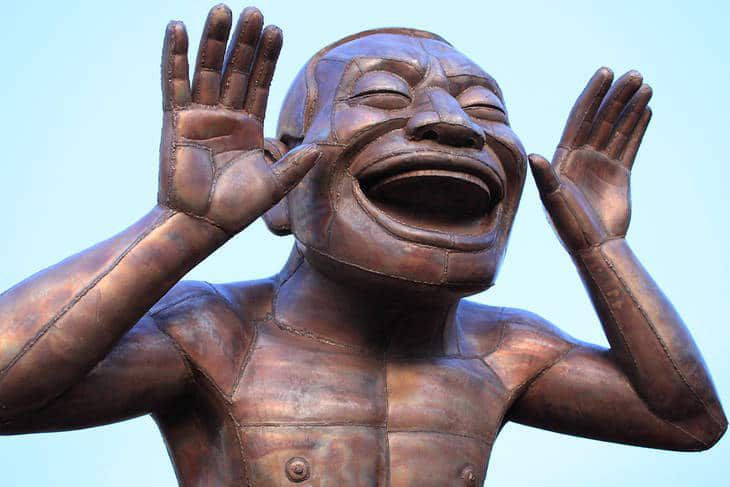 Bronze figure laughing - The joke's on you