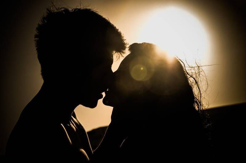 Silhouette of young couple kissing - Questioning rape culture
