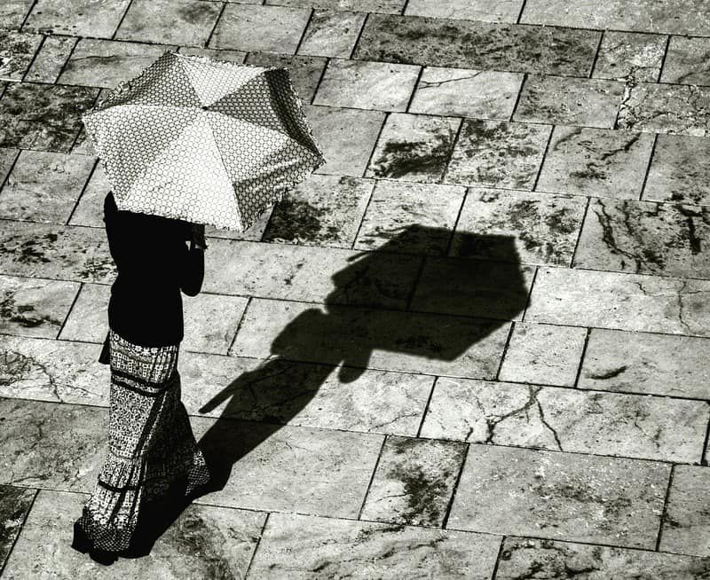 woman with umbrella with shadow