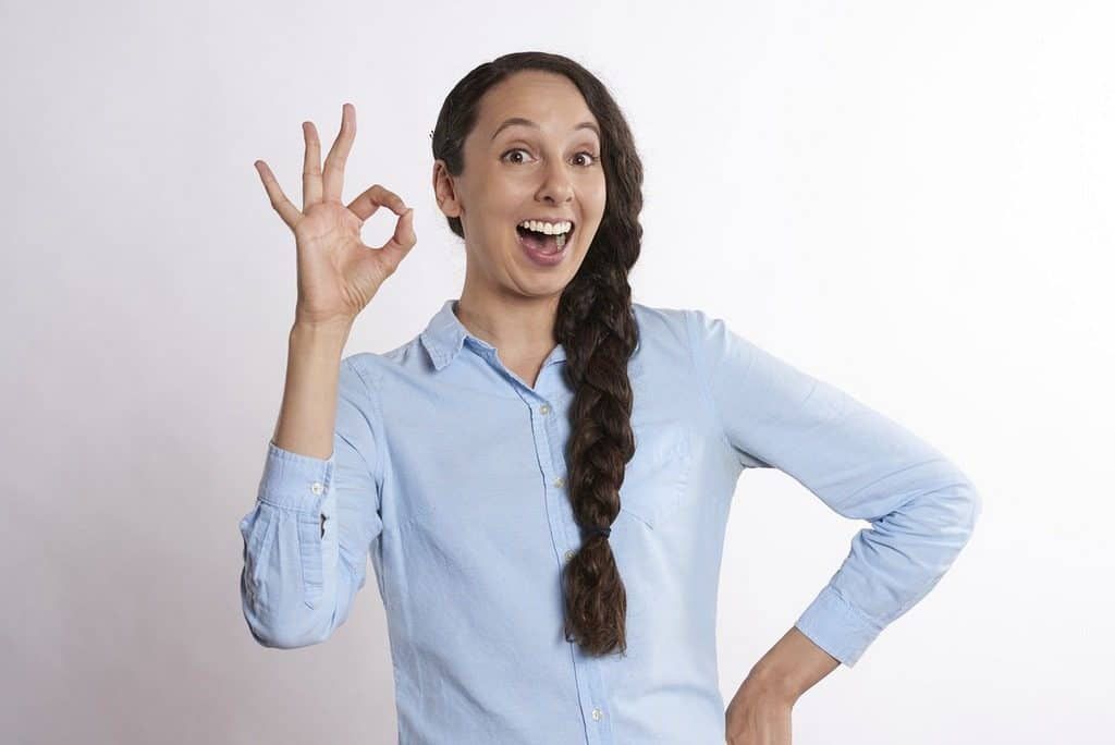woman making ok sign with her fingers