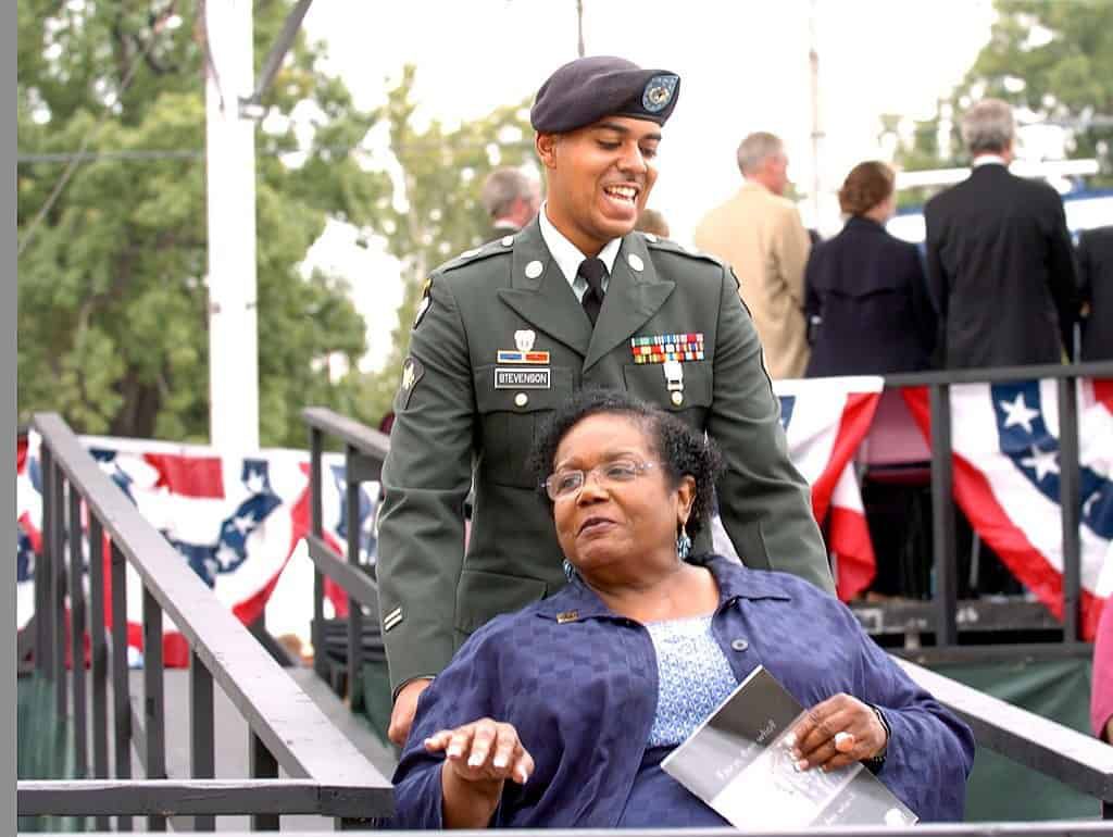 U.S. soldier pushing wheelchair of Melba Pattillo Beals - I will not fear