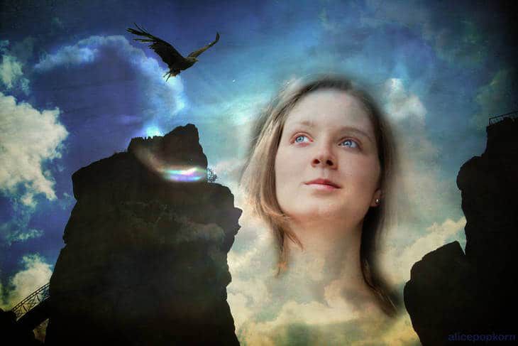Woman's face looking at clouds and cliffs - The elusiveness of mindful awareness
