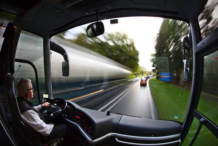 Man driving bus down blurry road - Choicelessly choosing choicelessness